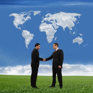 Handshake with World Map and Grass iStock_000006371021_Small